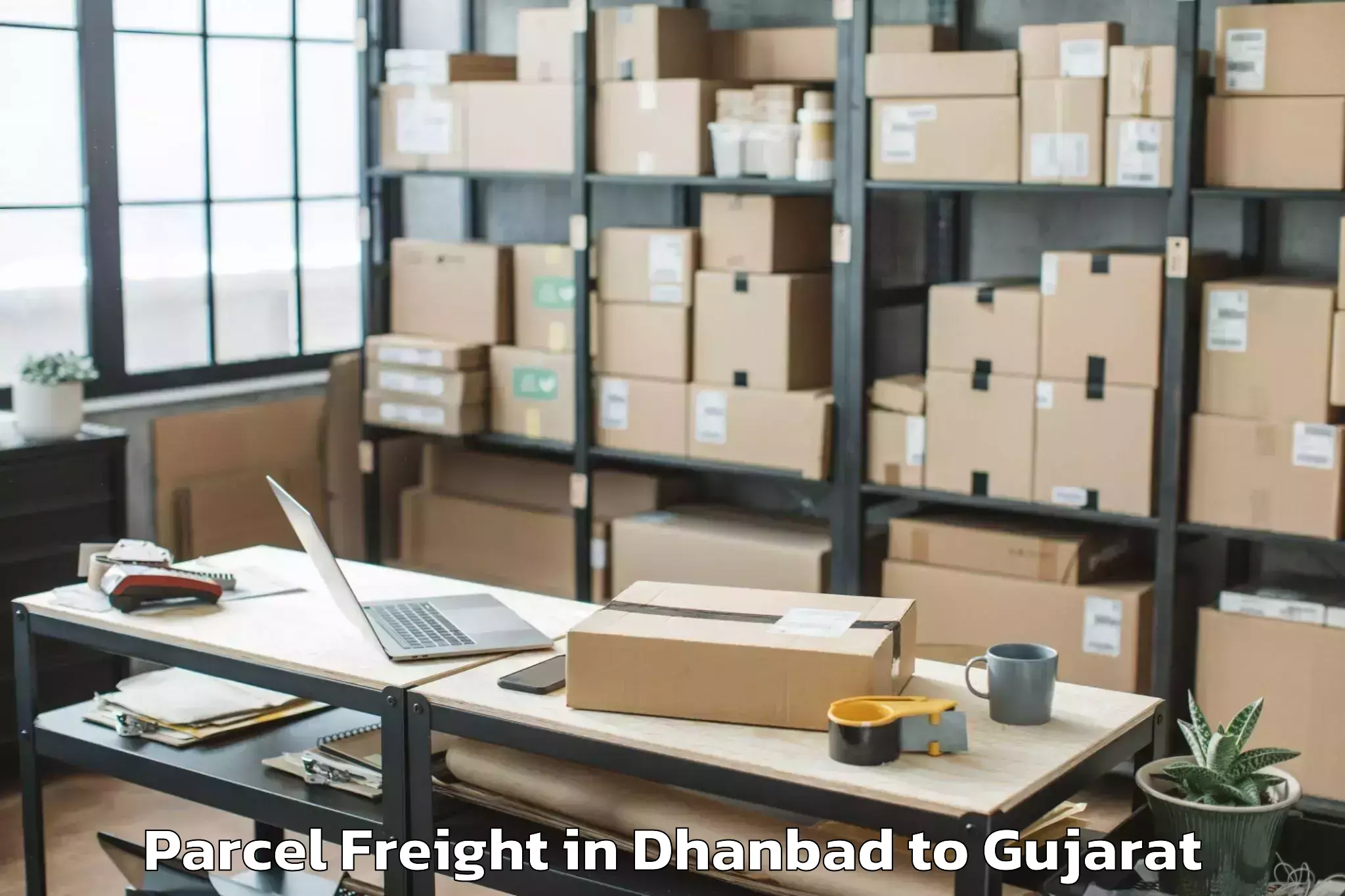 Book Dhanbad to Uchchhal Parcel Freight Online